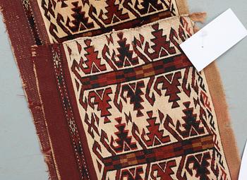 ANTIQUE TURKMEN FRAGMENT. Probably fragment of a kapunuk or a jollar. 24 x 130 cm.