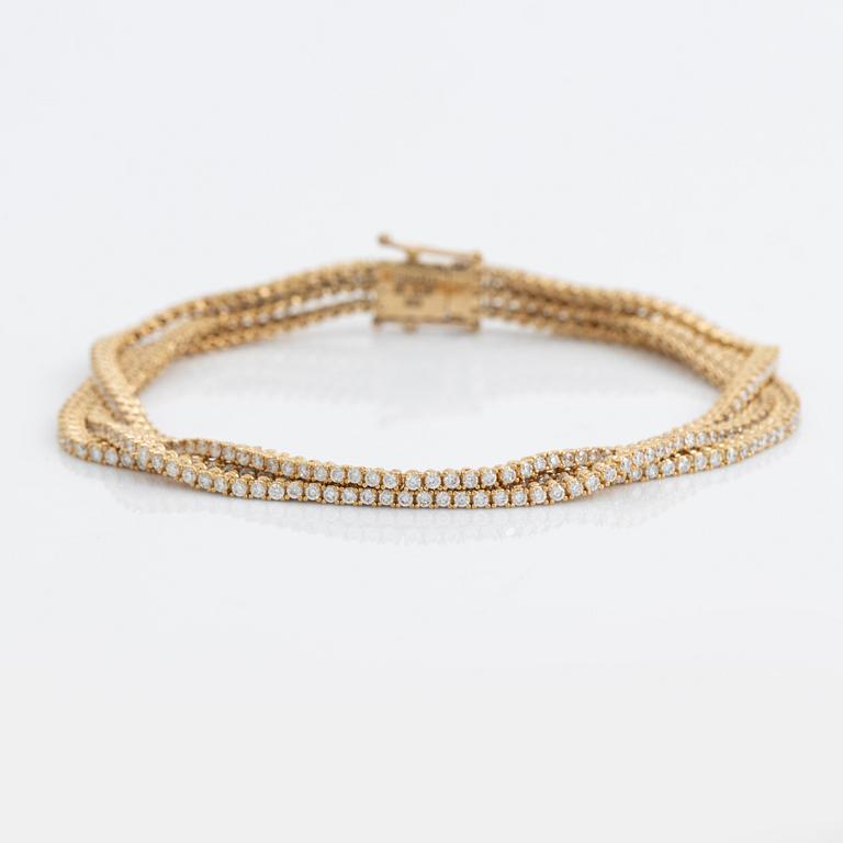 Brilliant cut diamond three strand bracelet.