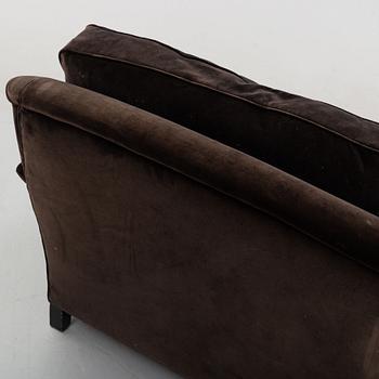 A contemporary velvet Howard sofa.