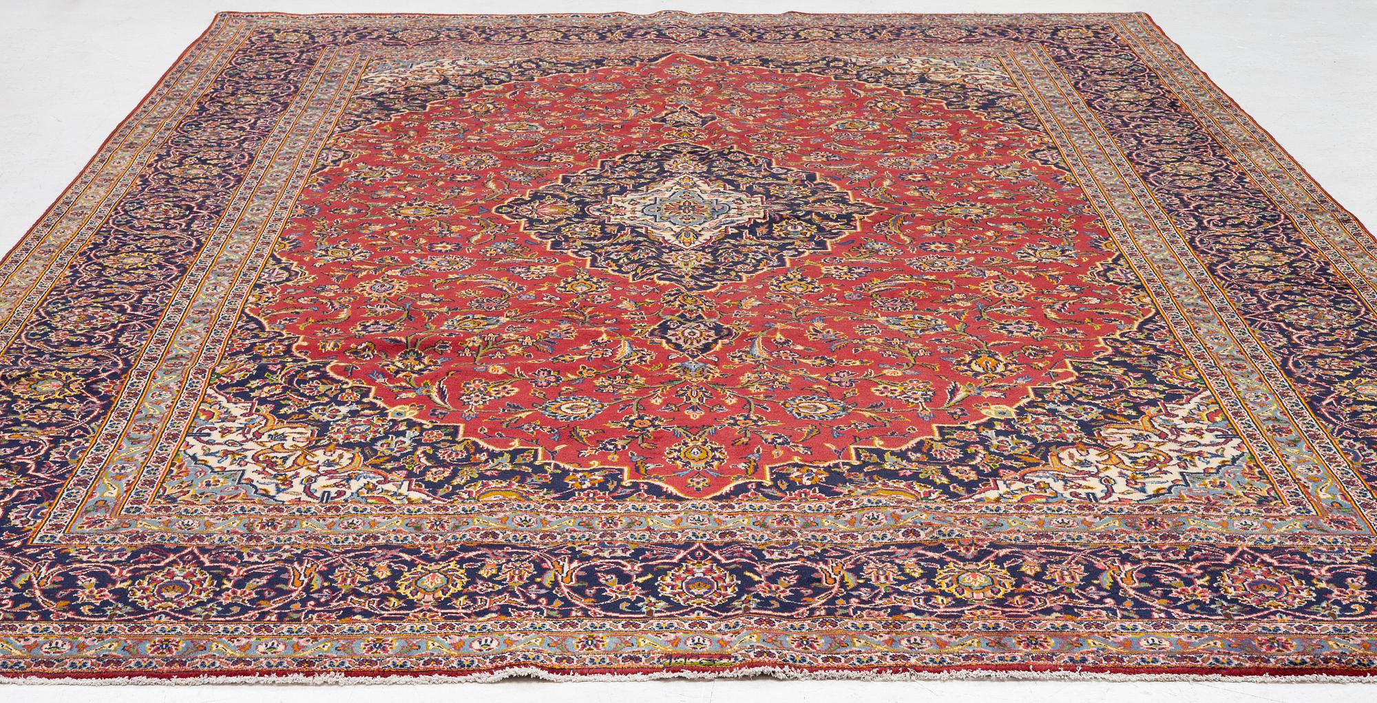 A Keshan carpet, central Iran, signed c, 392 x 301 cm.