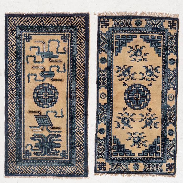 Two antique Chinese Pao-Tow rugs, c. 125 x 65 and 125 x 60 cm.