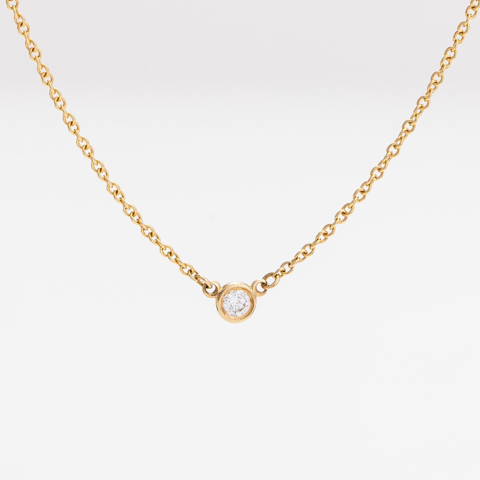 Tiffany & Co, Elsa Peretti, an 18K gold necklace with a ca. 0.05 ct diamond.