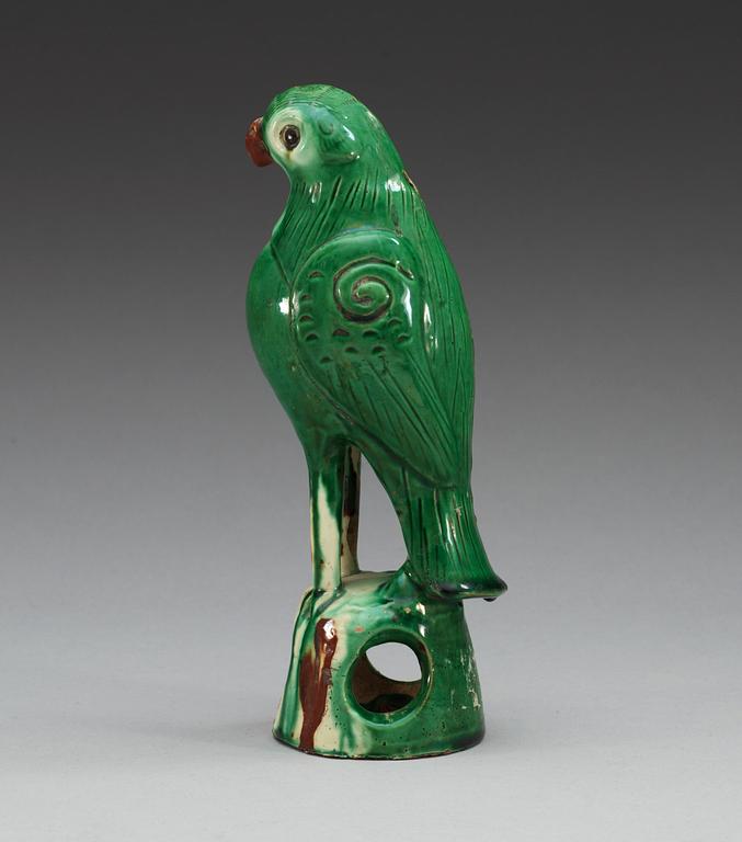 A green glazed figure of a falcon, Qing dynasty.