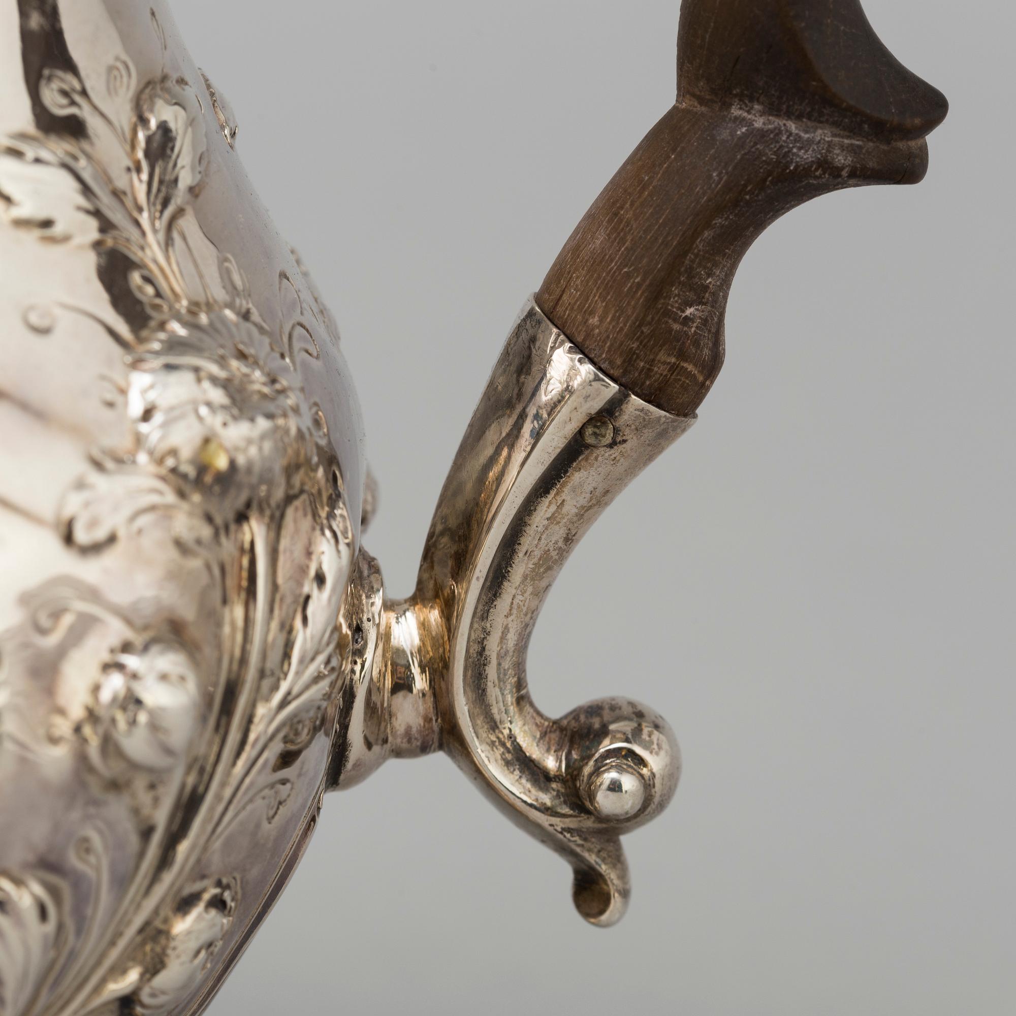 An English 18 th century silver coffee-pot, mark of Benjamin Gignac, London 1763.
