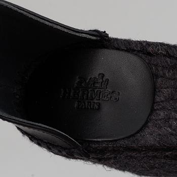 HERMÈS, a pair of black leather 'Tivoli' wedge sandals, 2019, size 38.