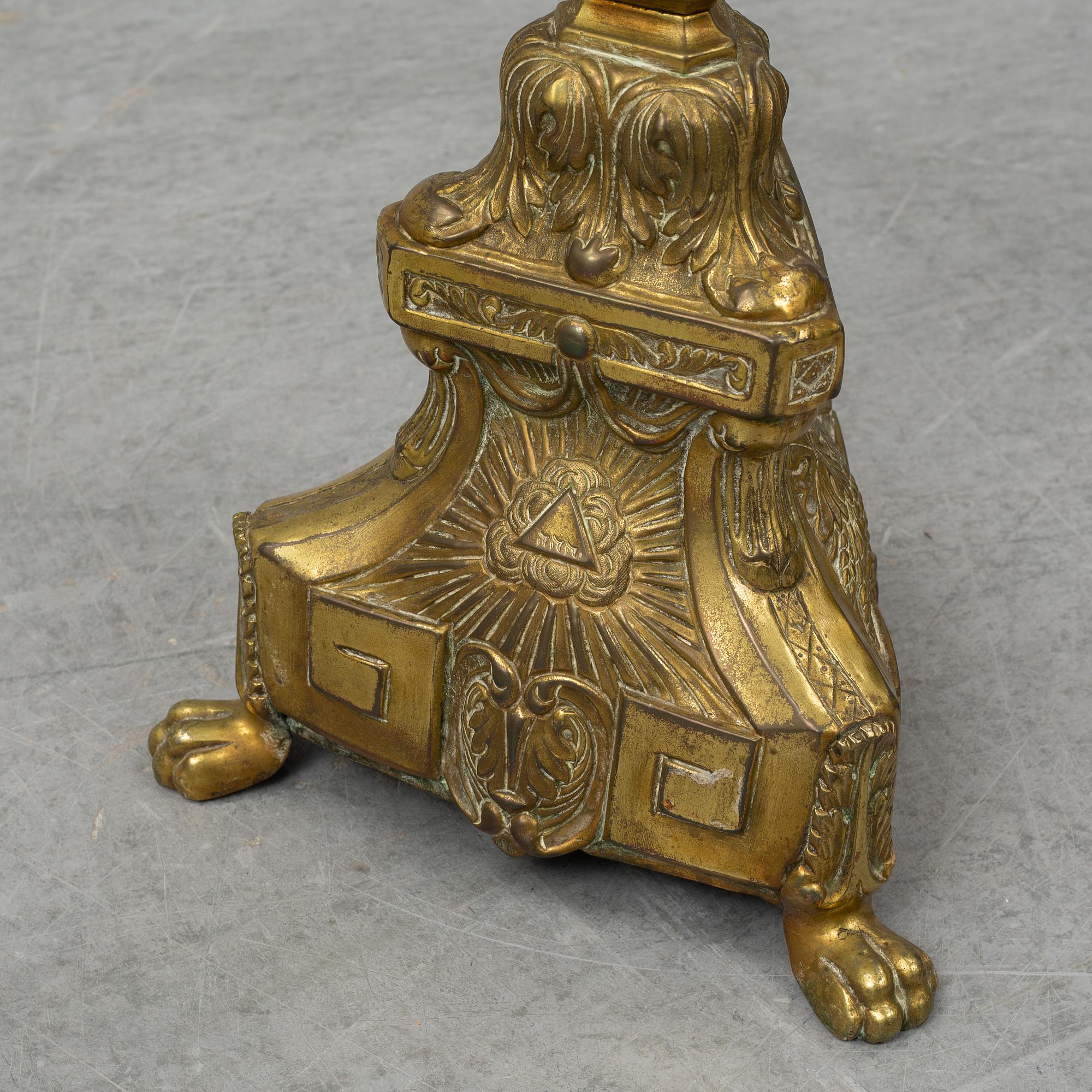 A pair of 18th century brass floor candlesticks.