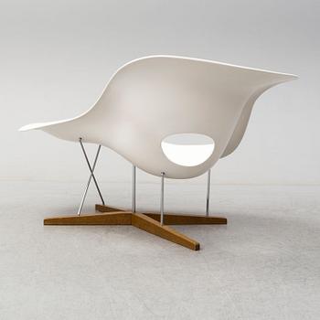A 'La Chaise' lounge chair by 
Charles & Ray Eames, for Vitra.