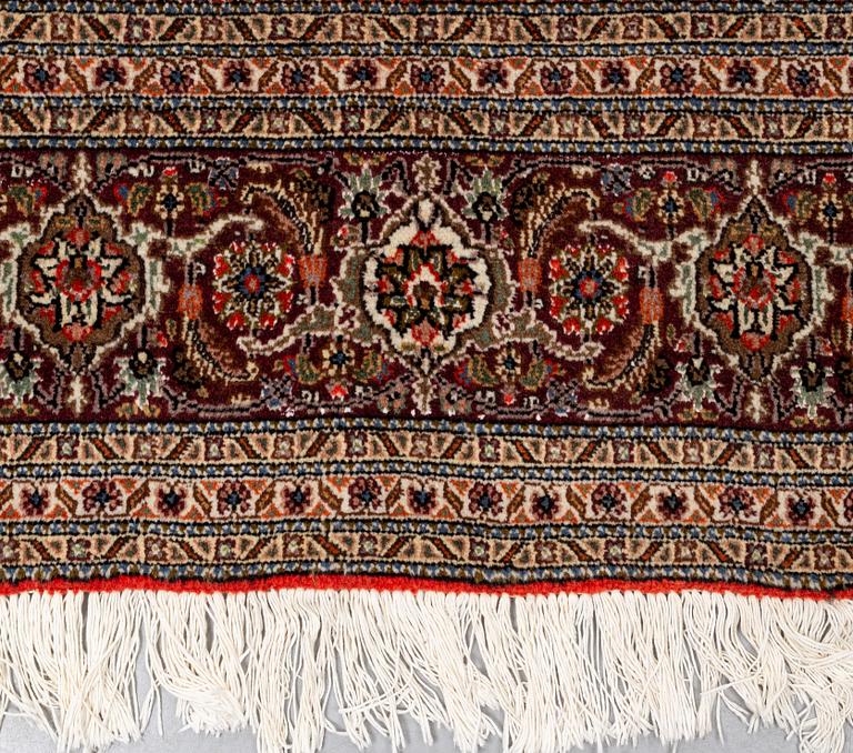 A carpet, Tabriz, part silk, 40-50 Radj, ca 300 x 195 cm.