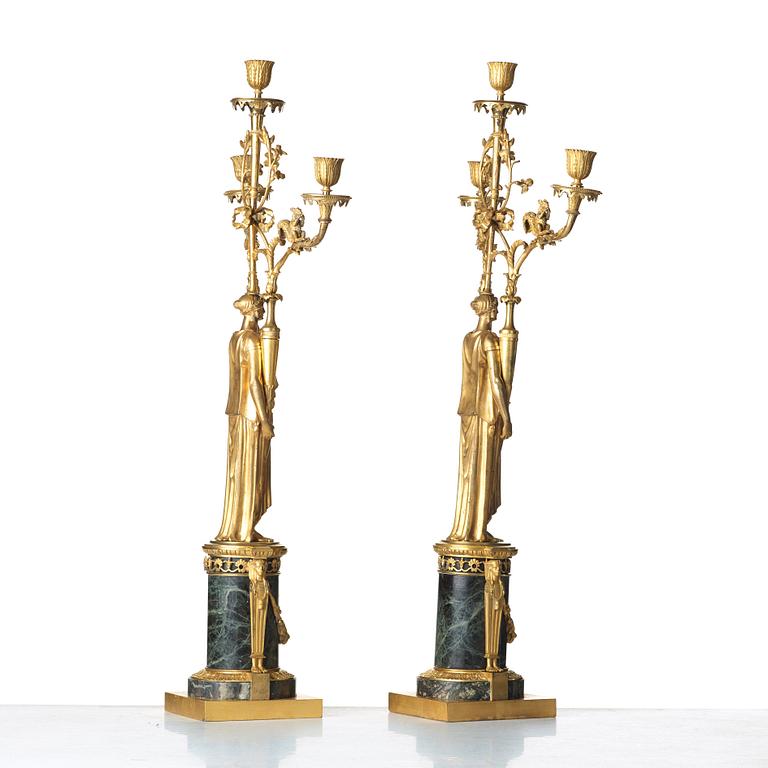 A pair of French Directoire three-light candelabra, circa 1800.