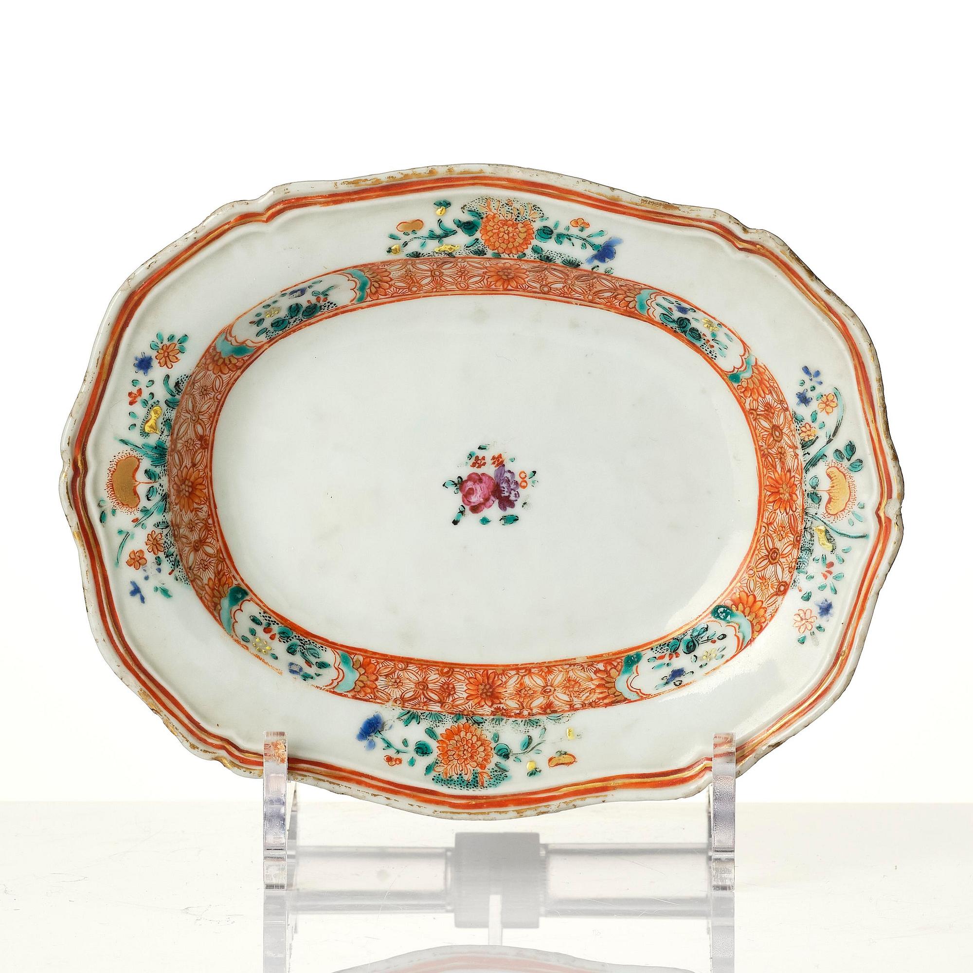 A famille rose butter tureen with cover and stand, Qing dynasty, 18th century.