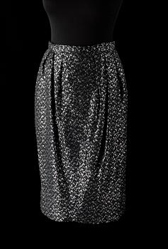 An ensemble consisting of skirt, top, belt and scarf by Christian Dior.