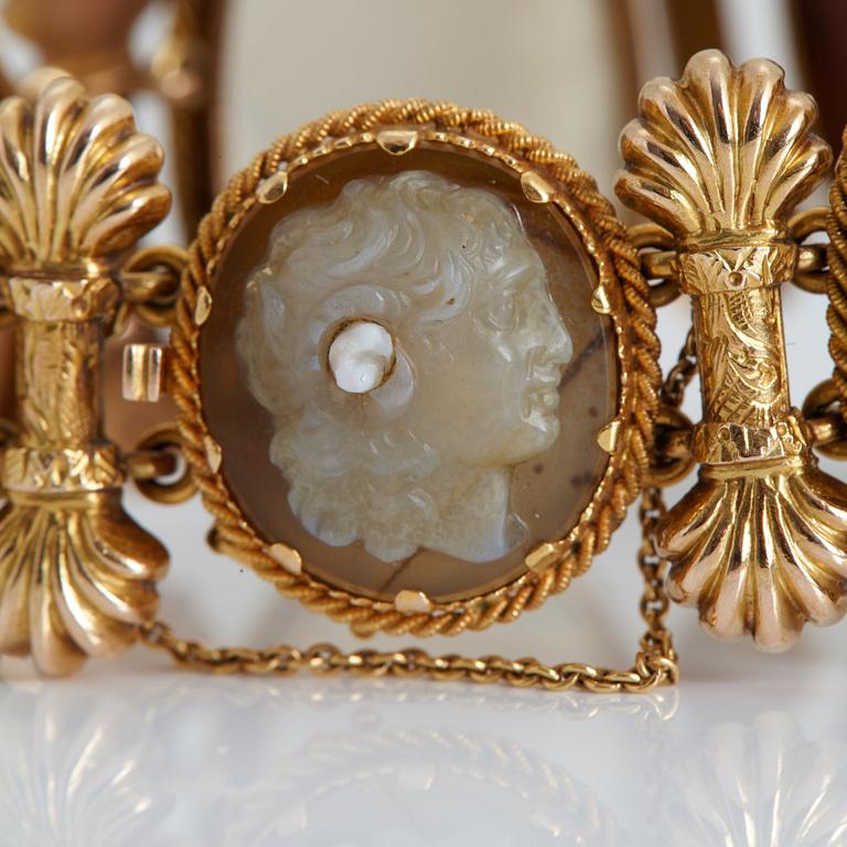 A BRACELET set with seven hardstone cameos.