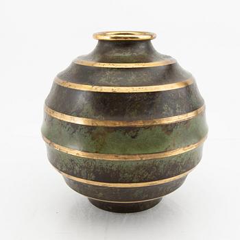 A 1930s metal vase.
