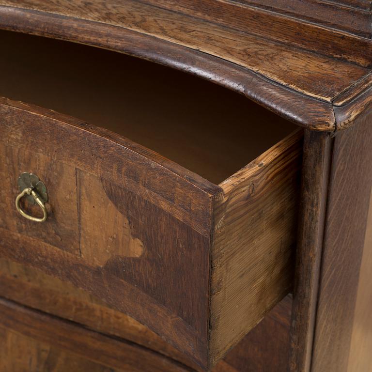 An 18th century oak and walnut cabinet.