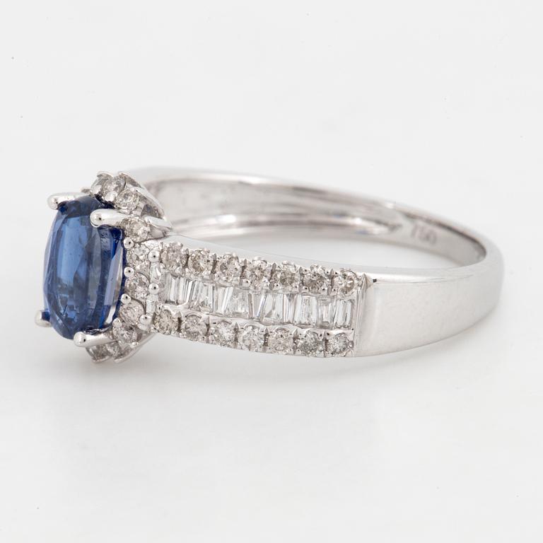 Kyanite and brilliant-cut diamond ring.
