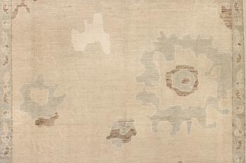 An Ushak design carpet, a. 426 x 307 cm.