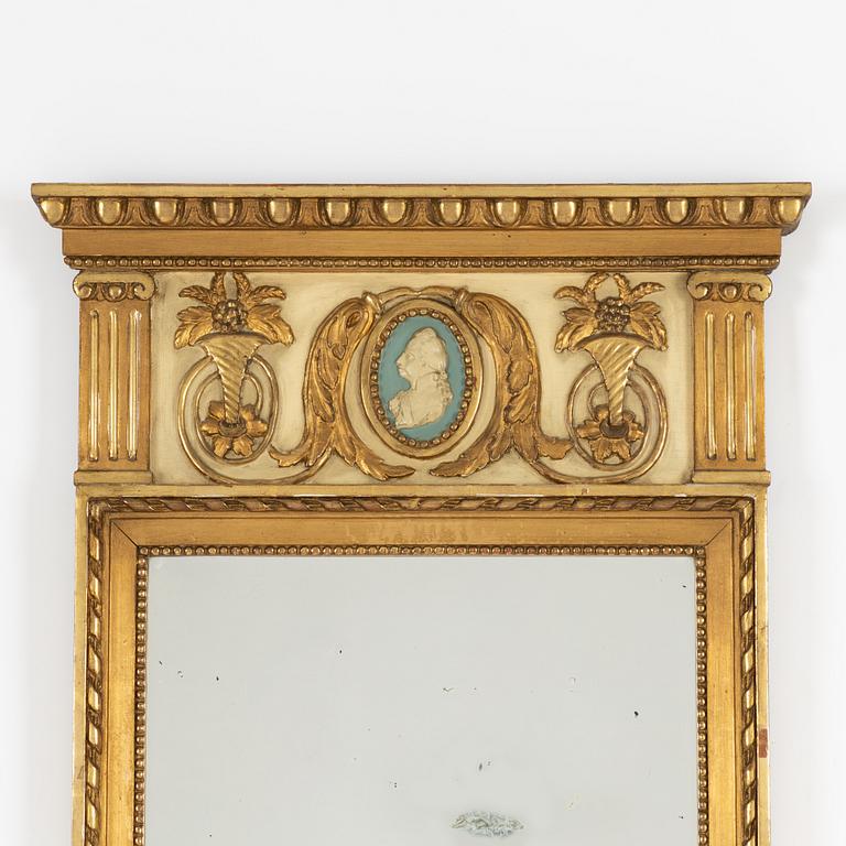 A Gustavian style mirror, circa 1900.