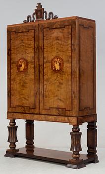 A Gösta Thorell Swedish Grace cabinet in stained birch, palisander, mahogany and other wood inlays, Stockholm 1930.