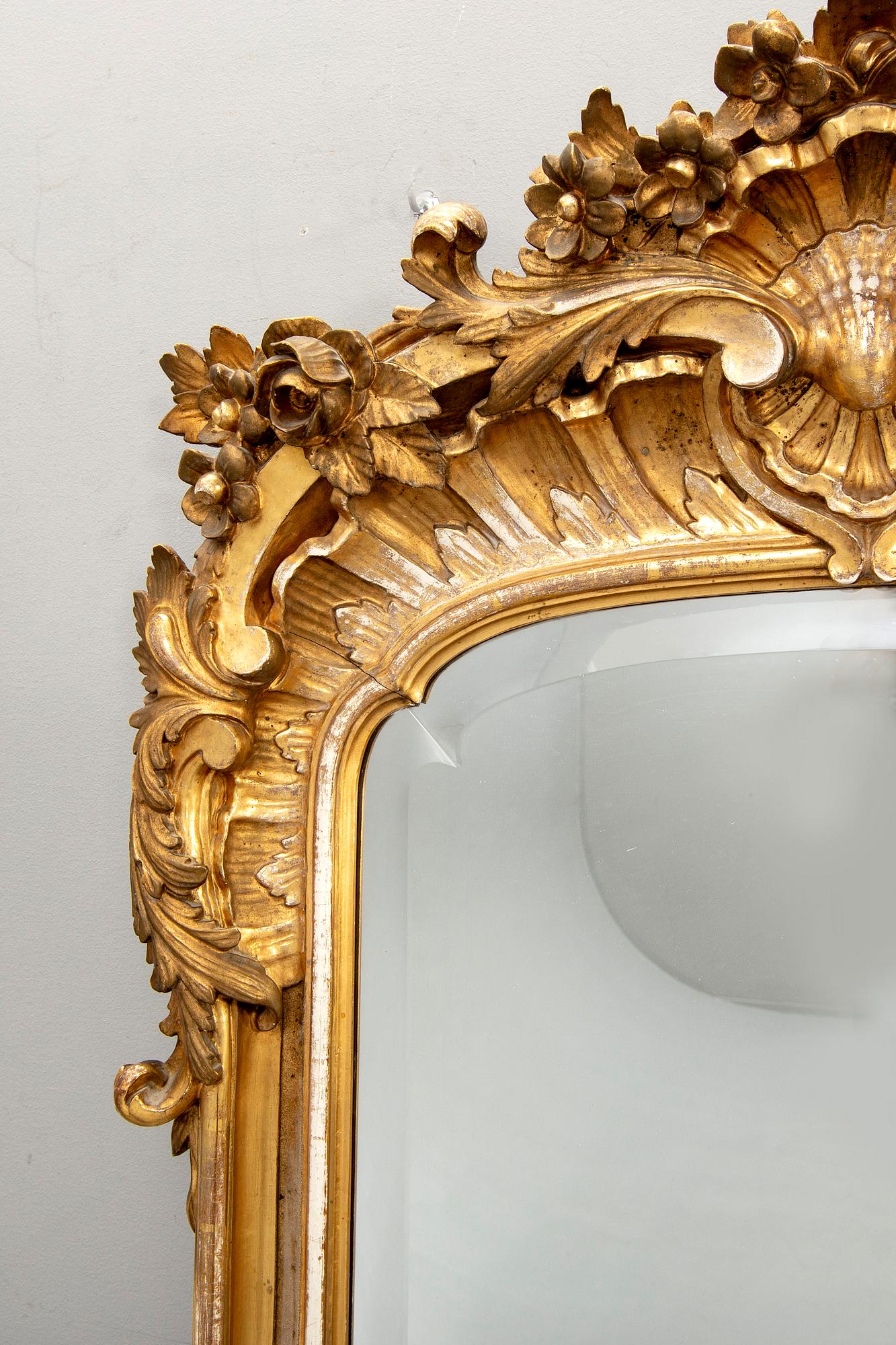 A Swedish Neo Rococo gilded signed mirror 1880s.