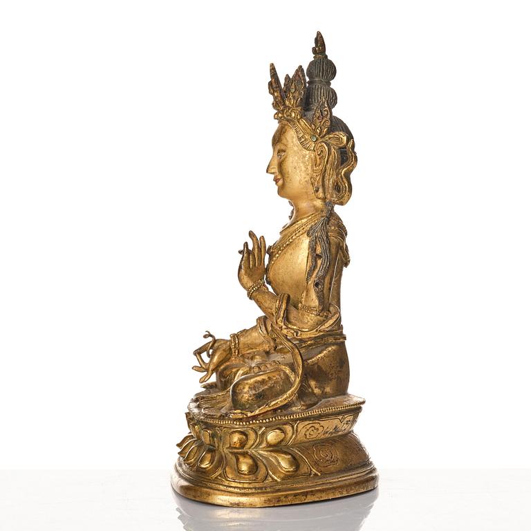 A Tibeto-Chinese/Mongolian gilt bronze figure of White Tara, 18th Century.