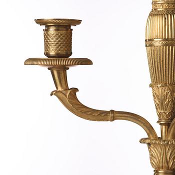 A pair of French Empire early 19th century four-light candelabra.
