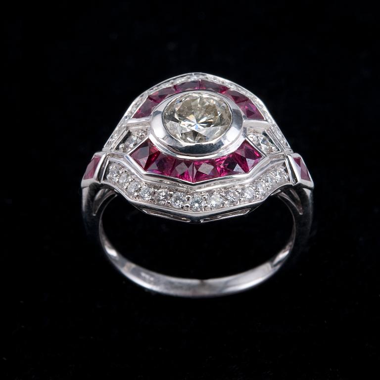 RING, briljantslipade diamanter 1 x 1.00 ct + 0.37 ct. Fancy slipade rubiner.