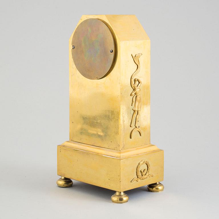 A circa 1800 brass mantel clock.