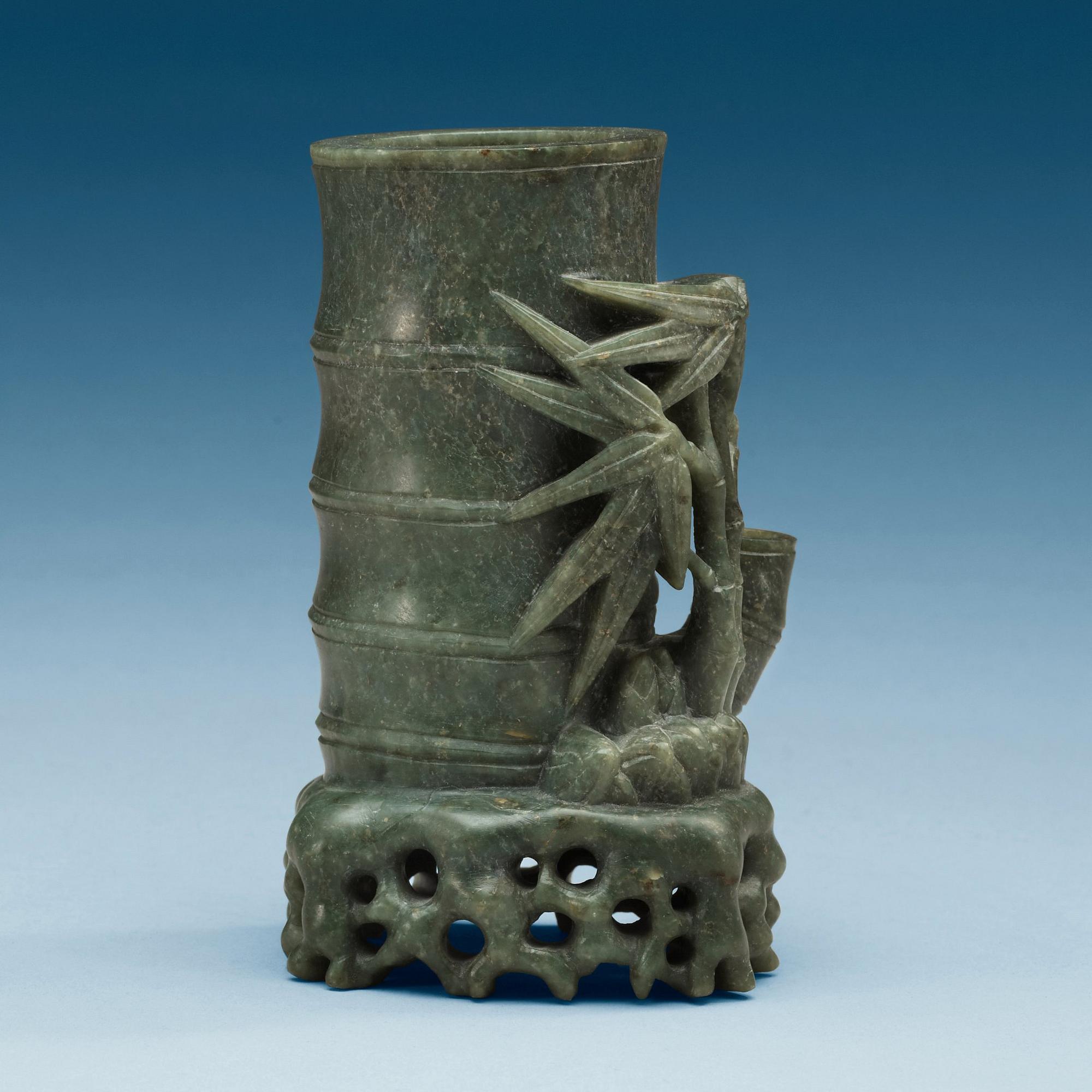 A green stone brush pot, China, 20th Century.