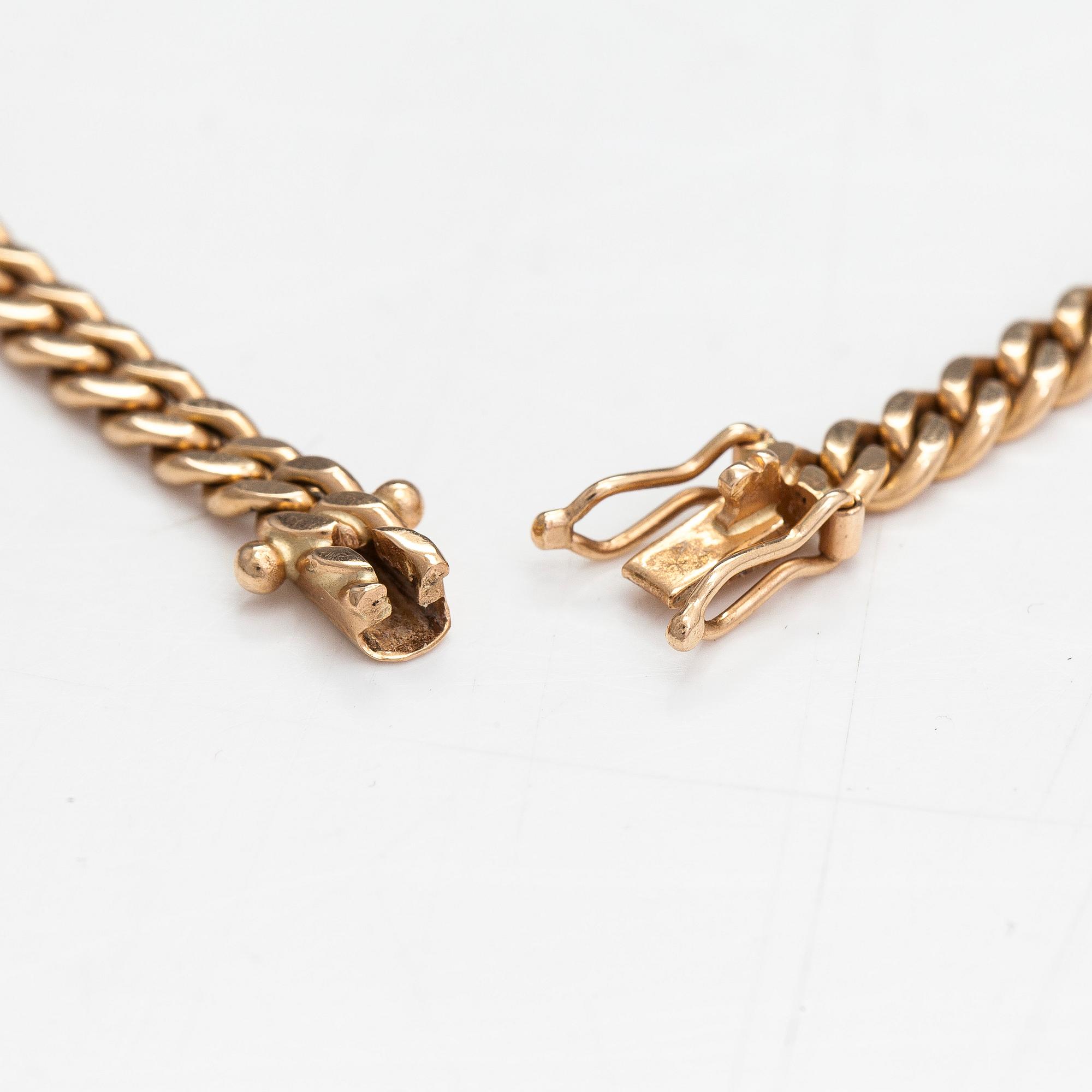 Necklace, cross, 18K/14K gold with diamonds totaling approx. 0.55 ct, Finland 1971/2007.