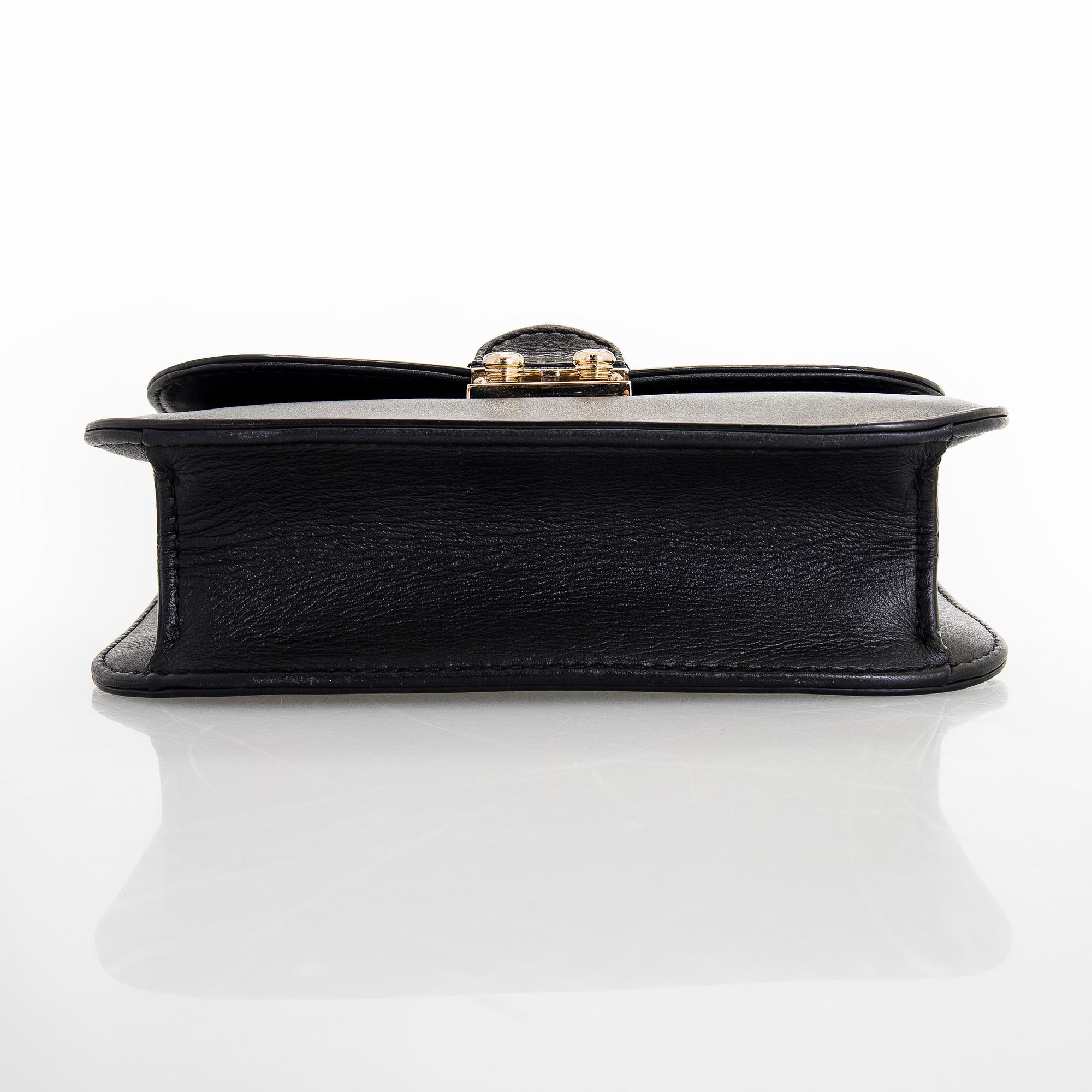 Valentino Garavani, a 'Glam Lock' bag.