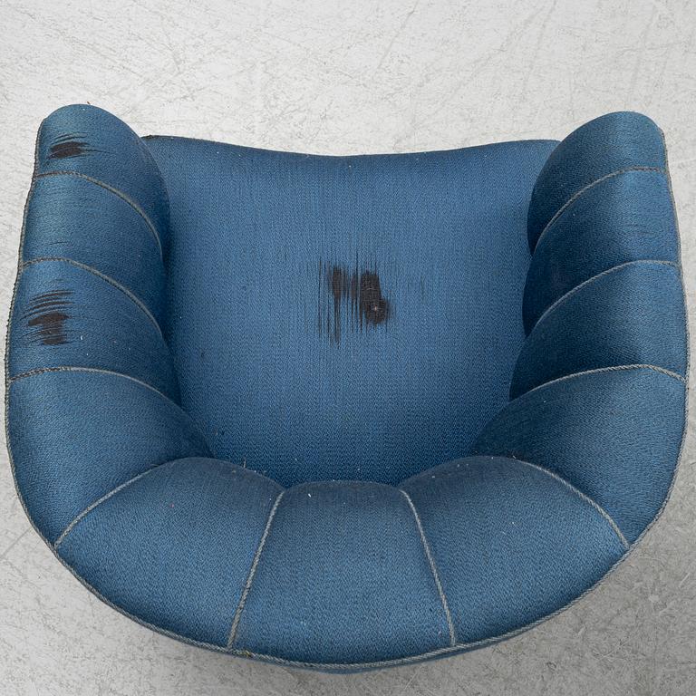 A pair of 1950's armchairs.