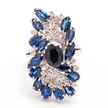 A 12K white gold ring with diamonds ca. 0.30 ct in total and sapphires. 1970's.