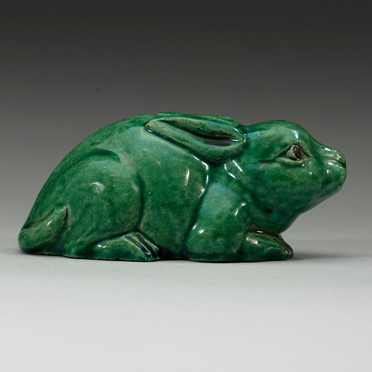 A green glazed figurine, Qing dynasty (1644-1912).