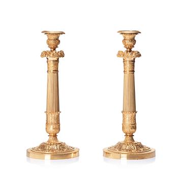 108. A pair of French Empire candlesticks, first part of the 19th century.