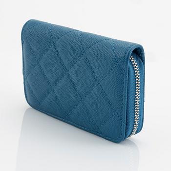 Chanel, a blue caviar leather wallet.