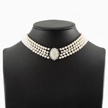 Necklace, four-row with cultured pearls, clasp 18K white gold set with opal and brilliant-cut diamonds.