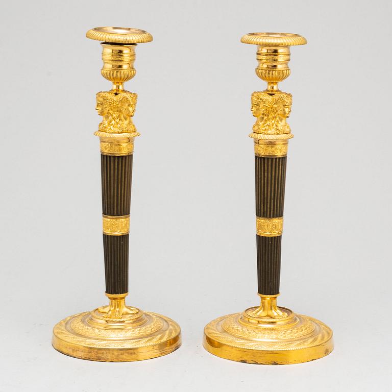 A pair of French Empire candlesticks, early 19th century.