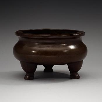 A bronze tripod censer, Ming dynasty (1368-1644).