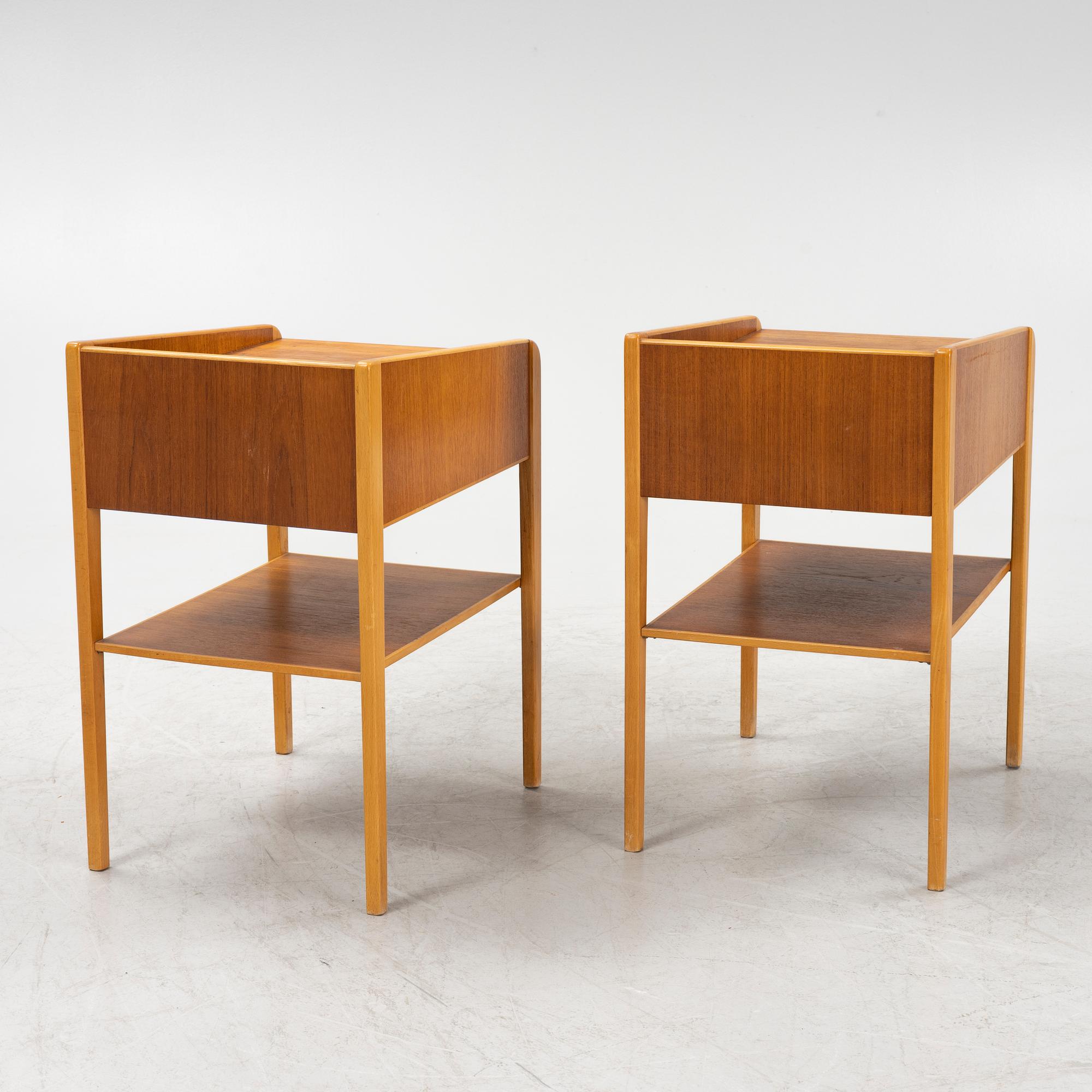 A pair of teak veneered bedside table, mid 20th Century.