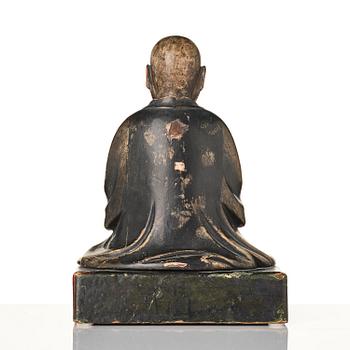 A painted and lacquered wooden sculpture of a monk, Japan, 19th century.