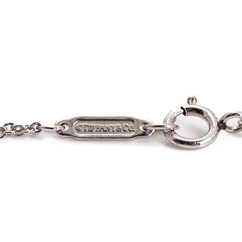 Tiffany & Co, rannekoru, platinaa ja briljanttihiottu timantti.