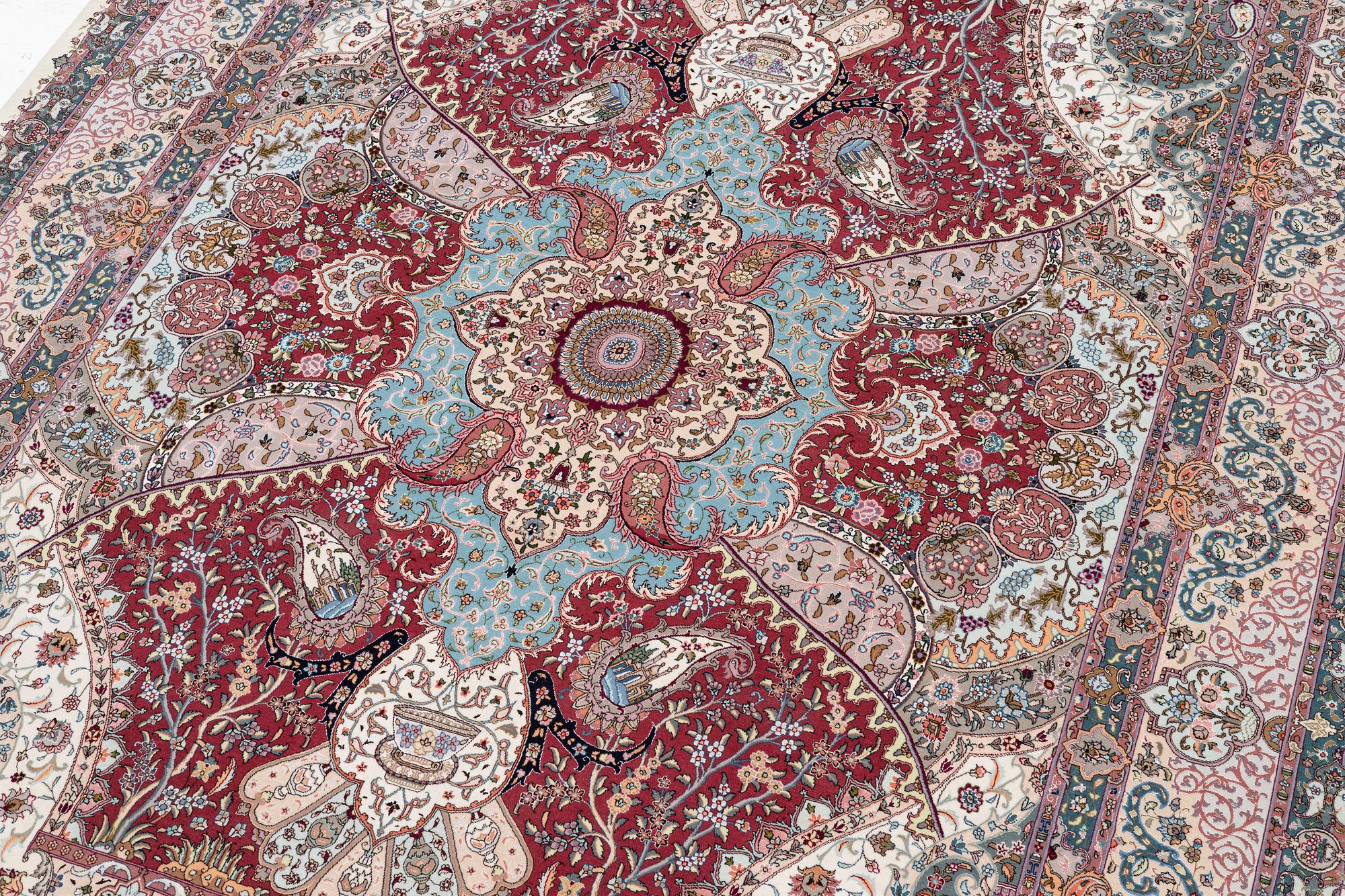 A Tabriz carpet, 210 x 195 cm. signed.