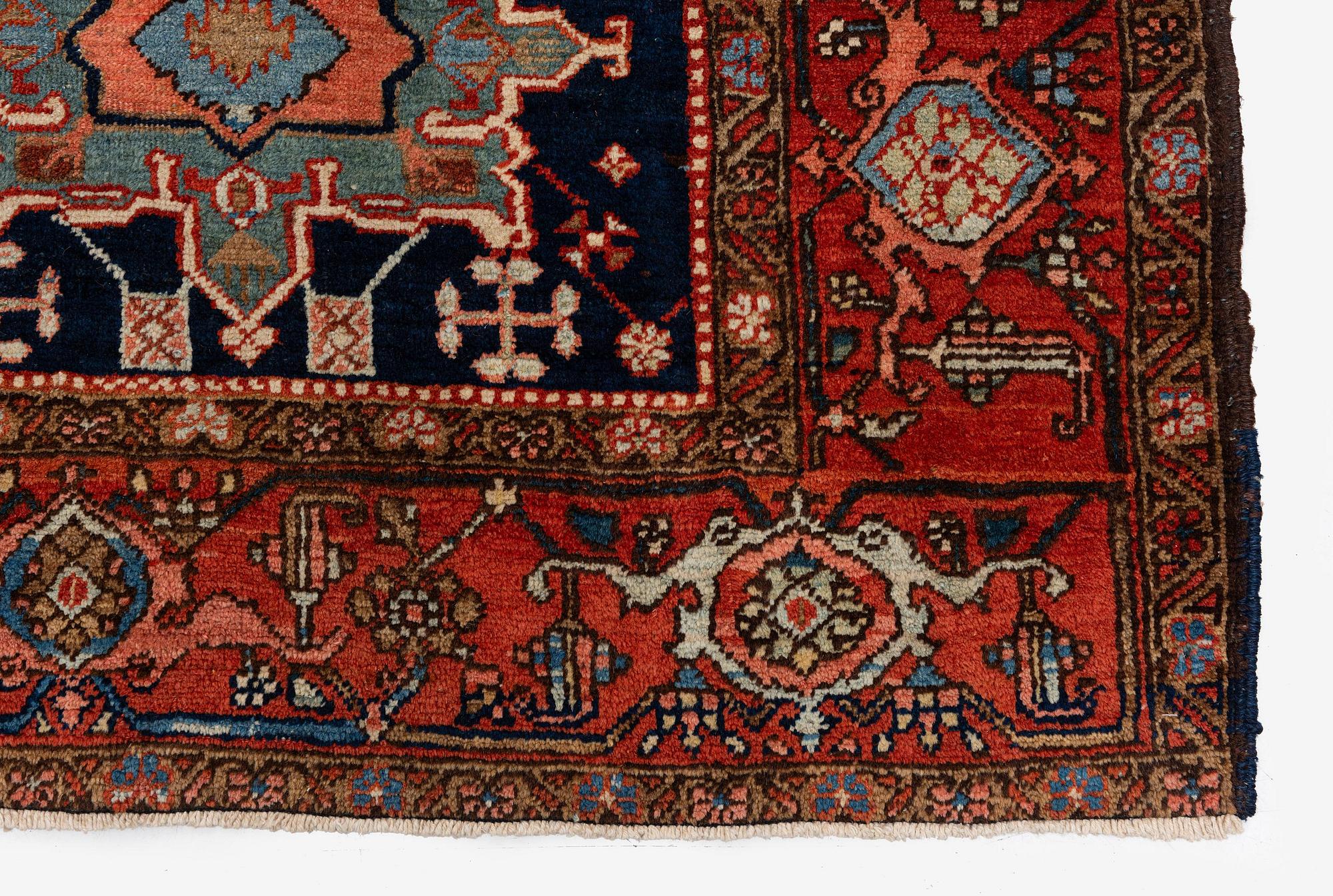 An antique Heriz carpet of karadja design, Northwest Persia (Iran), c. 338 x 239 cm.