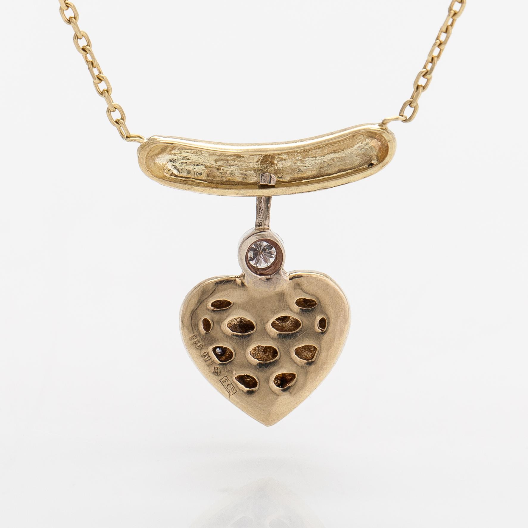 A 14K gold necklace with diamonds ca. 0.08 ct in total.