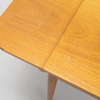 Josef Frank, a model 1007 mahogany drop leaf table, Svenskt Tenn, Sweden, second part of the 20th Century.