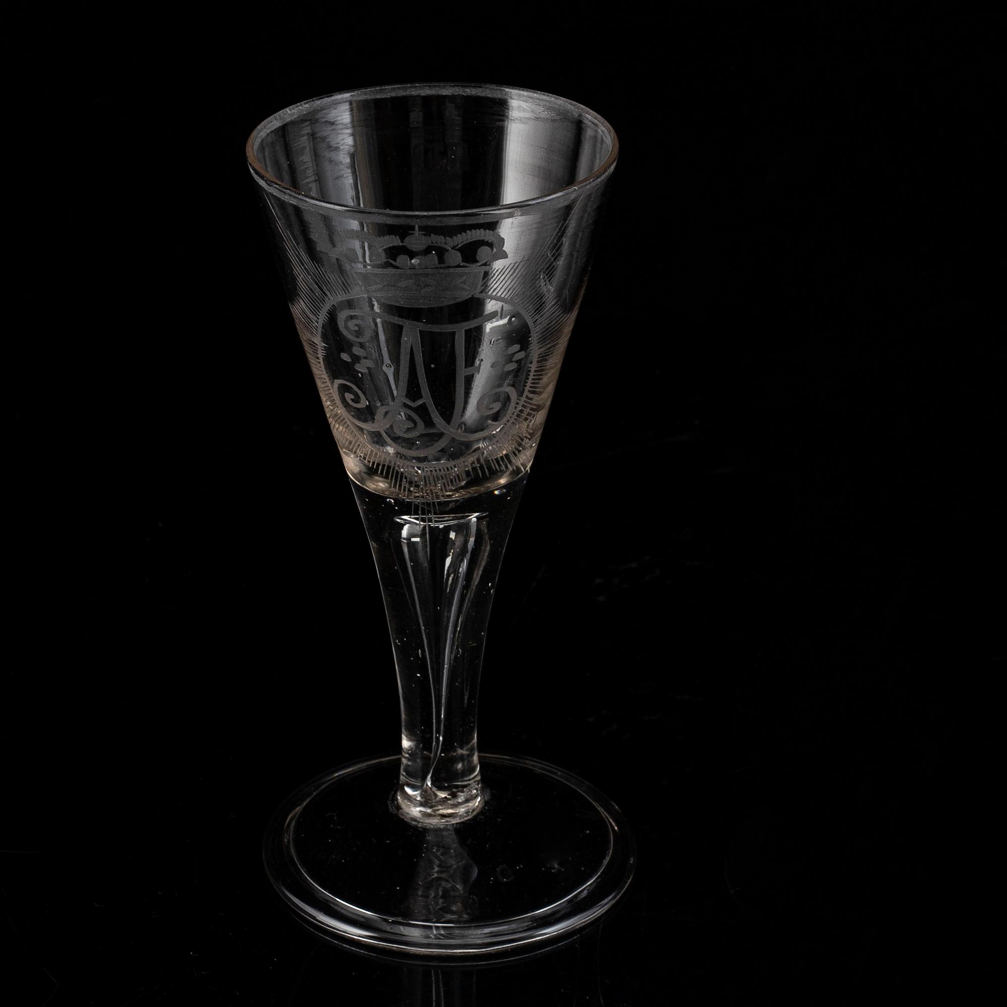 A wine glass with the monogram of the Swedish king Adolf Frederick, 18th Century.