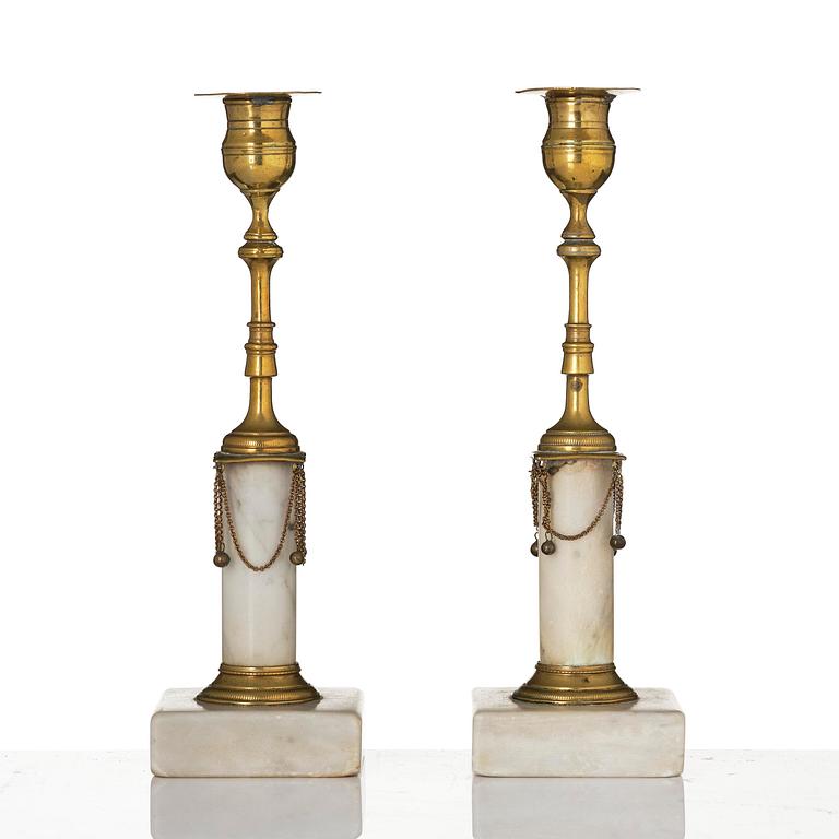 A pair of late Gustavian marble and gilt brass candlesticks, late 18th century.