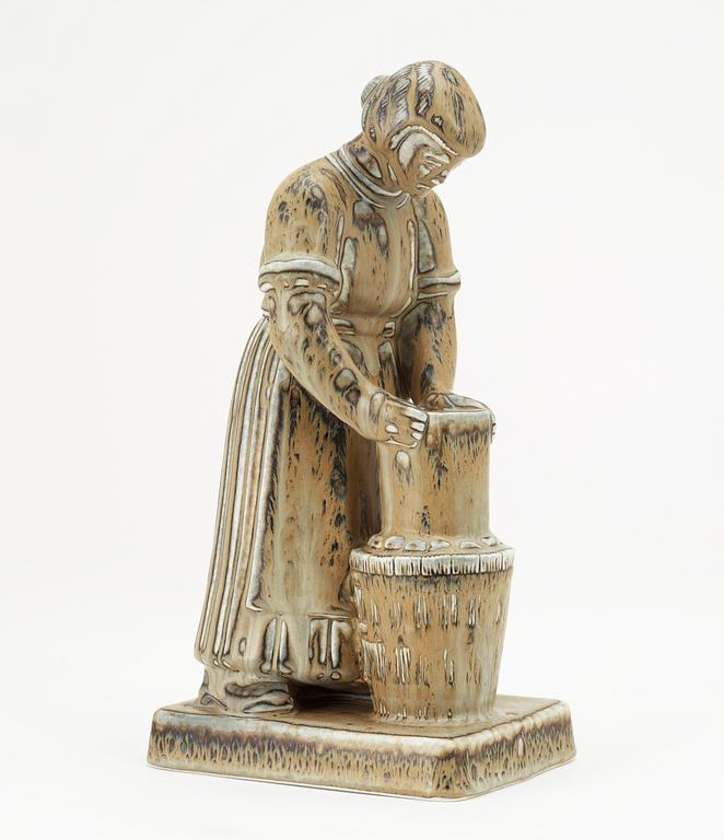 A Gunnar Nylund stoneware sculpture of a dairymaid, Rörstrand.