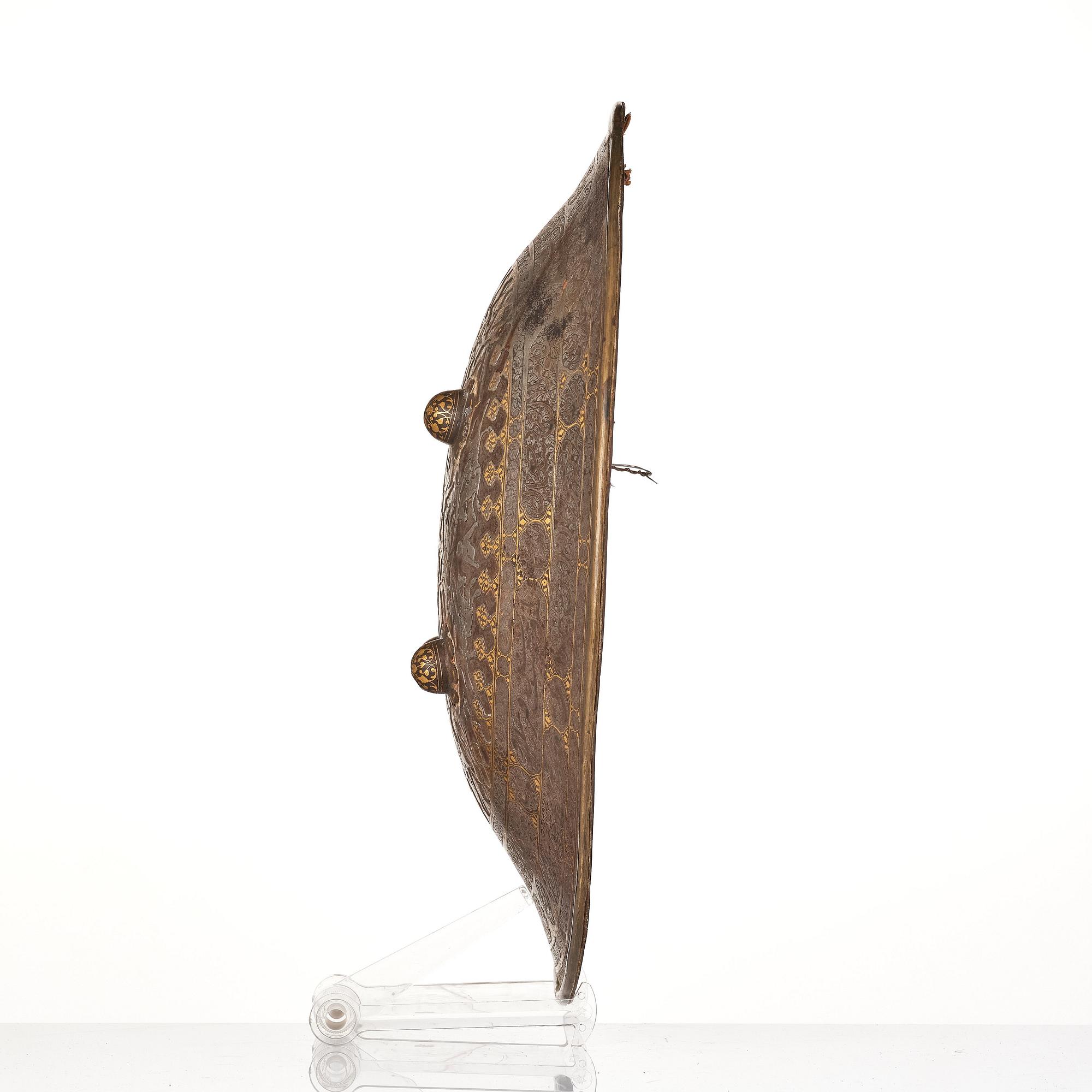 A gold-damascened steel shield, Qajar Iran, 19th century.