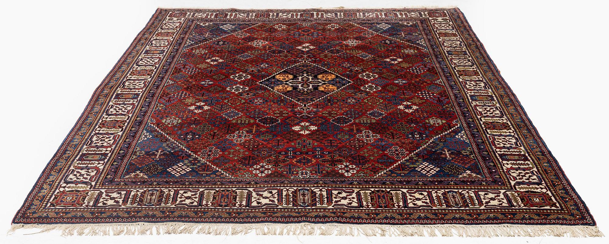 An antique Joshagan carpet, central Persia, c. 308 x 209 cm.